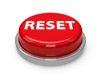 Red reset button isolated on white background, three-dimensional rendering, 3D illustration